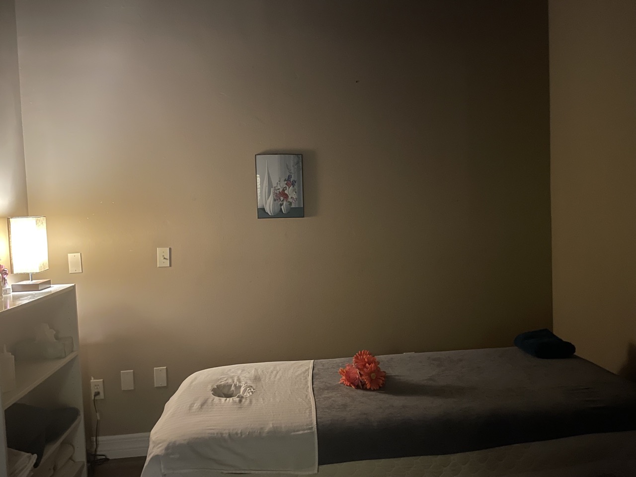 Treatment room with massage bed at Empire Massage and Spa